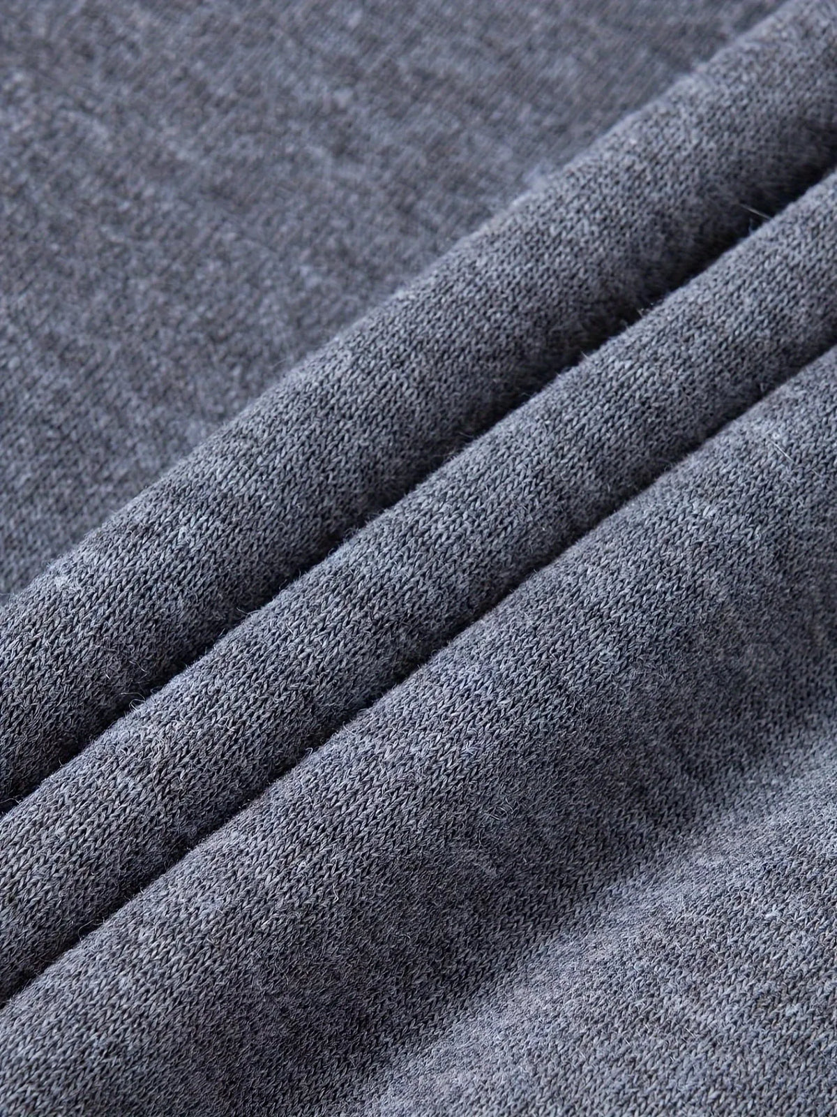 Close-up of soft brushed fleece fabric texture folded to show knit detail