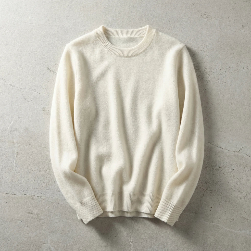Folded sky blue merino wool jumper viewed from a slight angle highlighting the relaxed sleeve drape