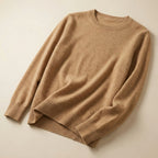 Folded lilac pink merino wool jumper with visible rib knit detailing at the hem and cuffs