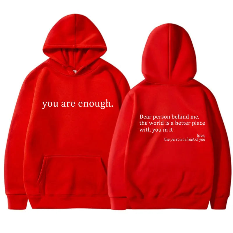 Red hooded jumper flat lay showing front chest print and back message print with drawstring hood