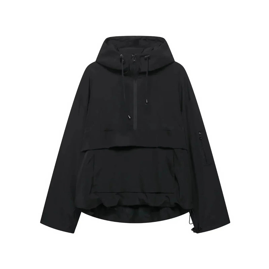 Black hooded anorak jacket with half-zip front, drawstring hood toggles and front pouch pocket, flat lay view