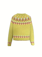 Flat lay back view of the greenish yellow cardigan showing the patterned yoke and ribbed cuffs and hem
