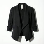 Black open-front blazer laid flat, highlighting the structured collar and clean front edge