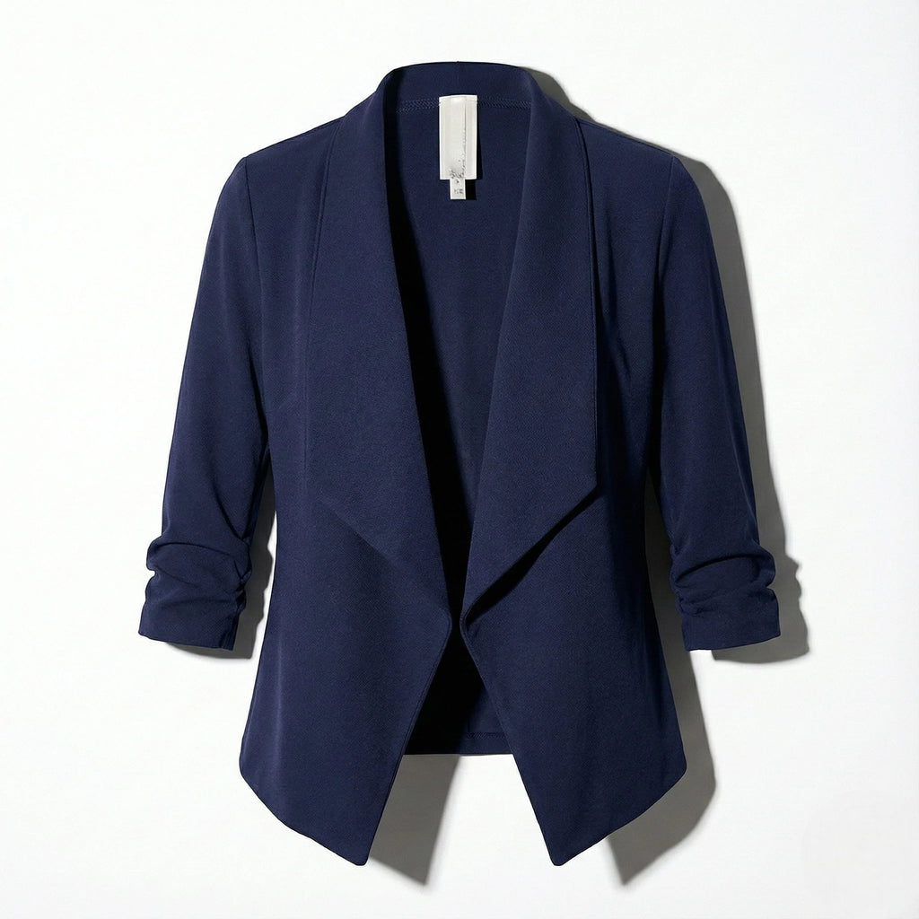Navy open-front blazer laid flat, showing the structured silhouette and gathered cuffs