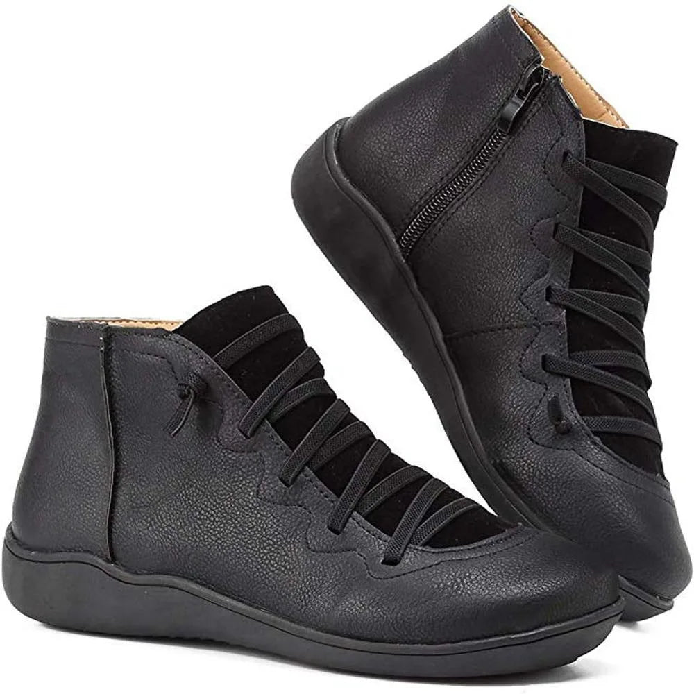 Black ankle boots with crisscross lacing and side zip, shown from front and side angles
