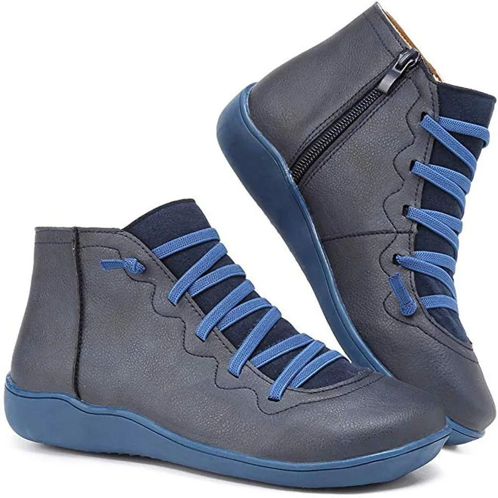 Navy blue ankle boots with contrast blue laces and zip pull, shown side by side