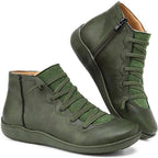 Olive green ankle boots with crisscross elastic laces and scalloped suede panel detail