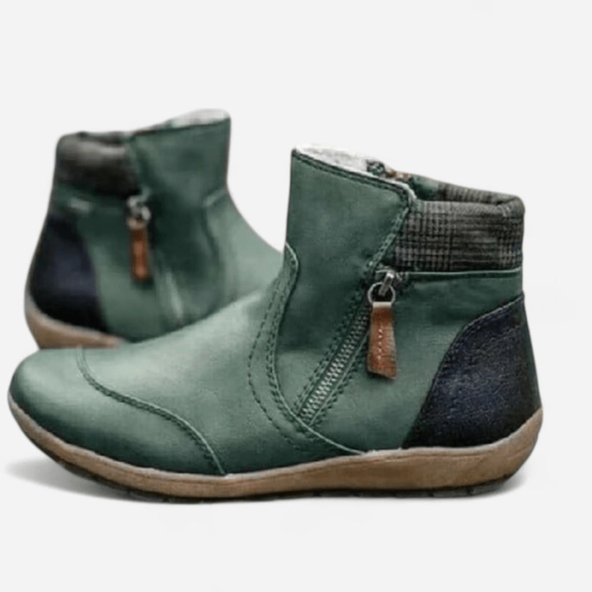 Side view of green leather ankle boots with side zip, tan pull tab and contrast heel panel