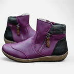 Purple leather ankle boots with black heel panel and checked cuff detail, angled view
