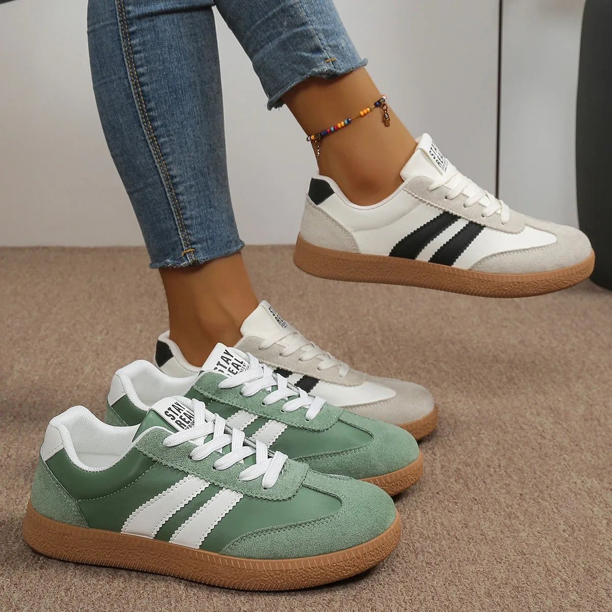 Pair of off-white and black trainers shown on foot and in hand with gum rubber sole