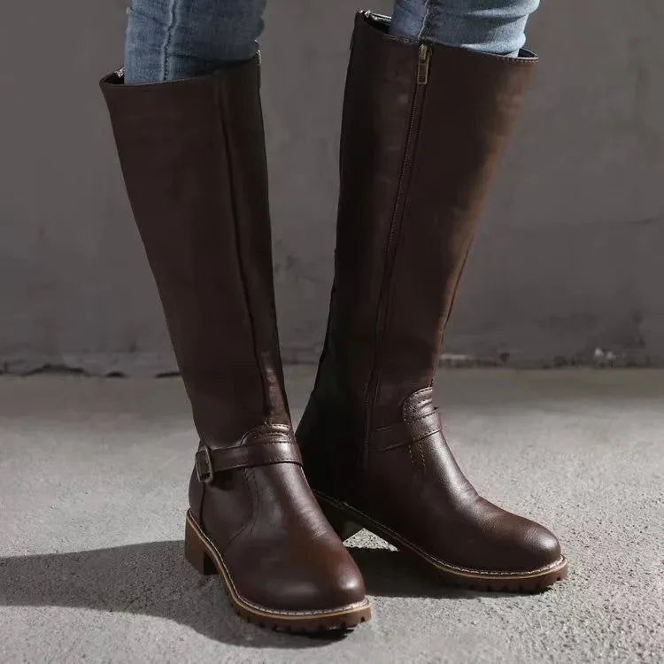 Front view of dark brown knee-high boots showing side zip closure and stacked block heel