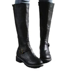 Pair of black knee-high boots on a plain background showing full straight-leg silhouette