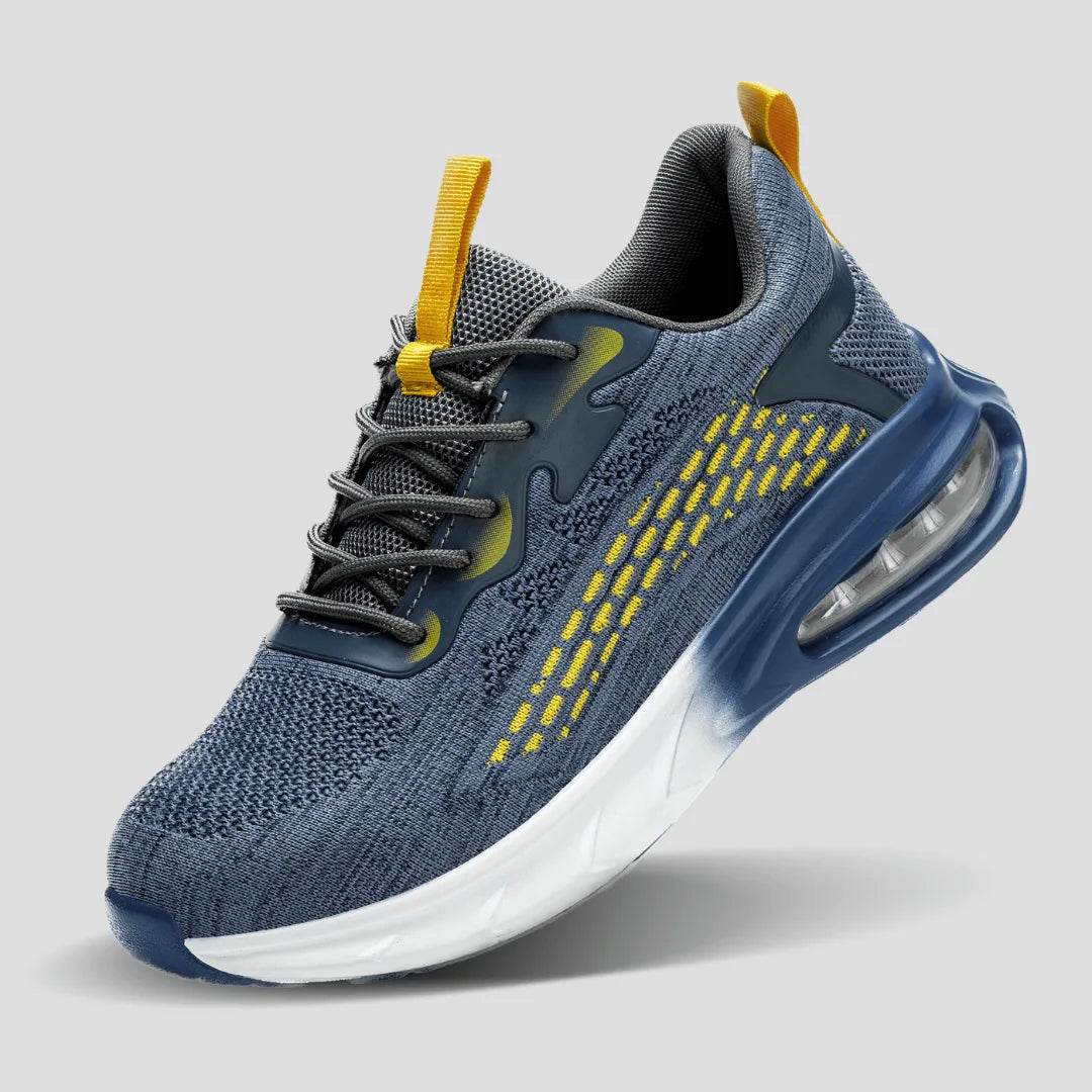 Three-quarter studio view of the complete blue trainer with yellow speckled overlay and white gradient sole