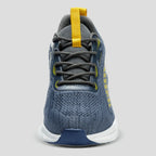 Front-on studio view showing the lace-up closure, grey laces, yellow pull tab and mesh tongue