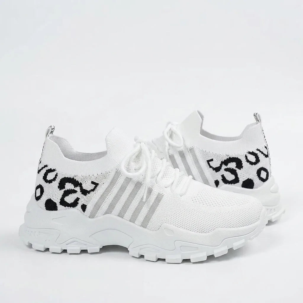 White knit trainer with black leopard print pattern on the heel and ankle collar