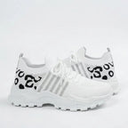 White knit trainer with black leopard print pattern on the heel and ankle collar