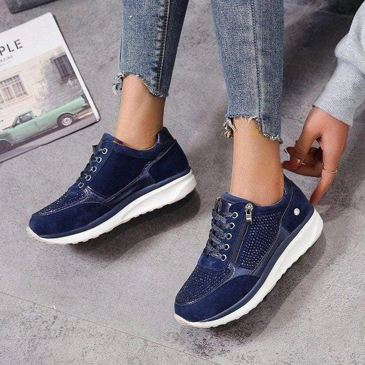 Navy blue lace-up trainer with diamante mesh panel and white platform sole, side zip visible