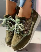Grey trainer with silver heel detail and side zip worn with cropped skinny jeans