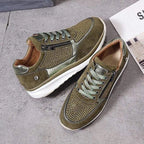 Grey suede trainer with silver toe cap and diamante mesh side panel, front angle close-up