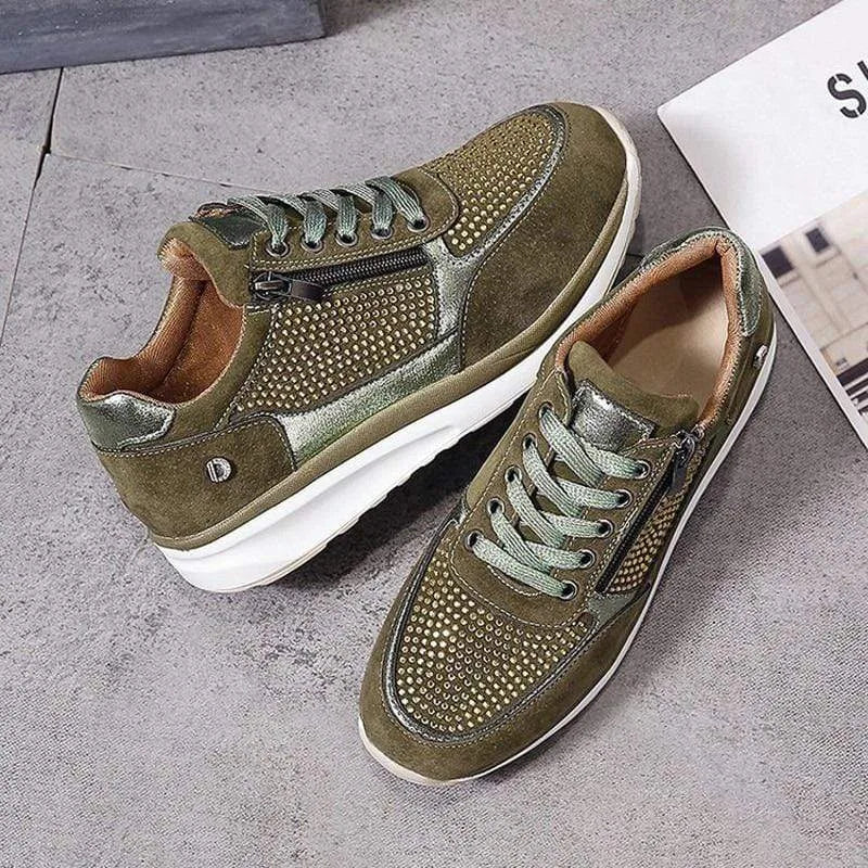 Grey suede trainer with silver toe cap and diamante mesh side panel, front angle close-up