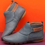Deep red leather ankle boots with tan side strap and contrasting sole