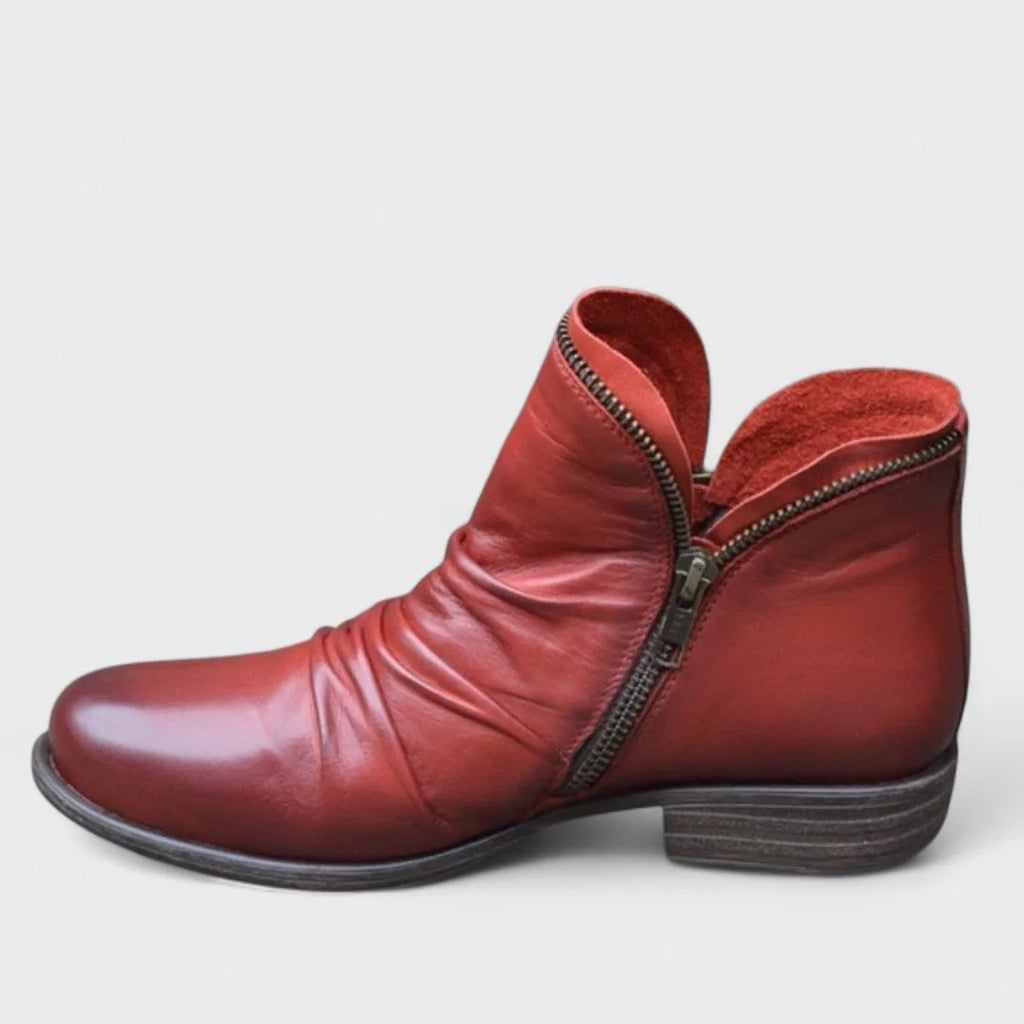 Deep red leather ankle boot with ruched front, bronze zip trim and low stacked heel