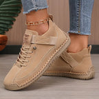 Beige tonal trainer with woven leather detailing on the toe and matching cream stitched sole