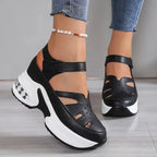 Black and white chunky platform sandals with strappy cutout ankle straps, front and side view on model
