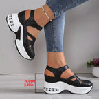 Black platform sandal with strappy cutout design and measurement label showing 10cm heel height