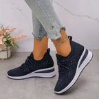 Navy blue trainers shown from above with sole visible, displaying blue rhinestone star clusters