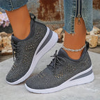 Pink knit trainers on foot with focus on ankle strap loop and cushioned wedge sole
