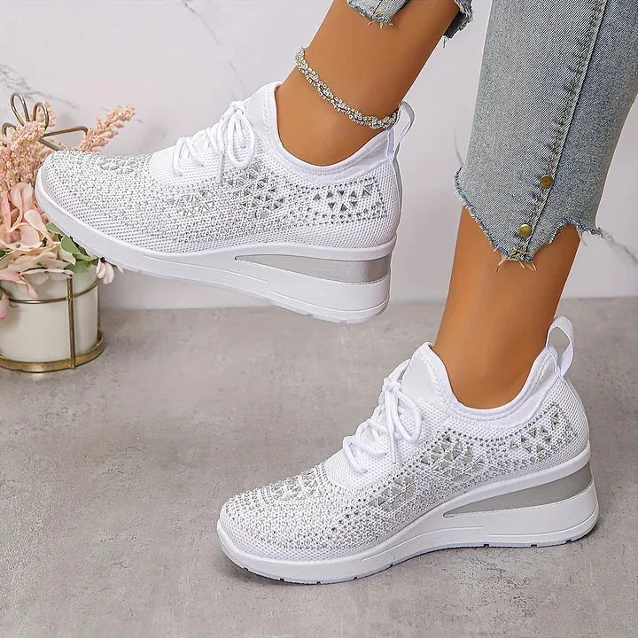 Bright fuchsia pink knit trainers with pastel rhinestone pattern and matching pink wedge sole