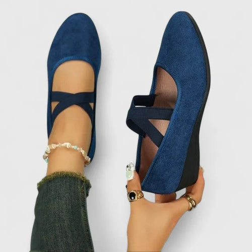 Navy blue suede ballet flats with crisscross ankle straps, front and side view of both shoes