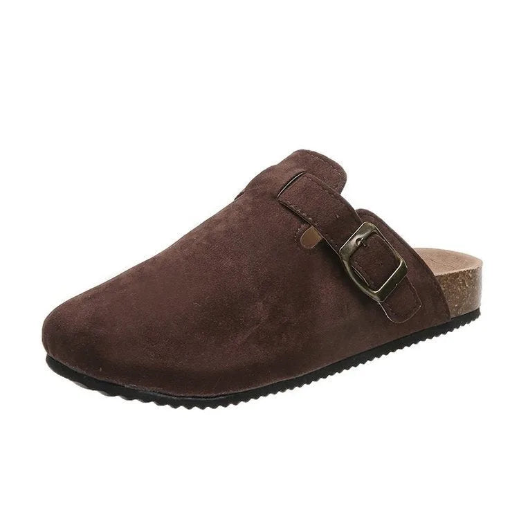 Single dark brown suede clog slipper shown in profile against white background, showing cork wedge sole
