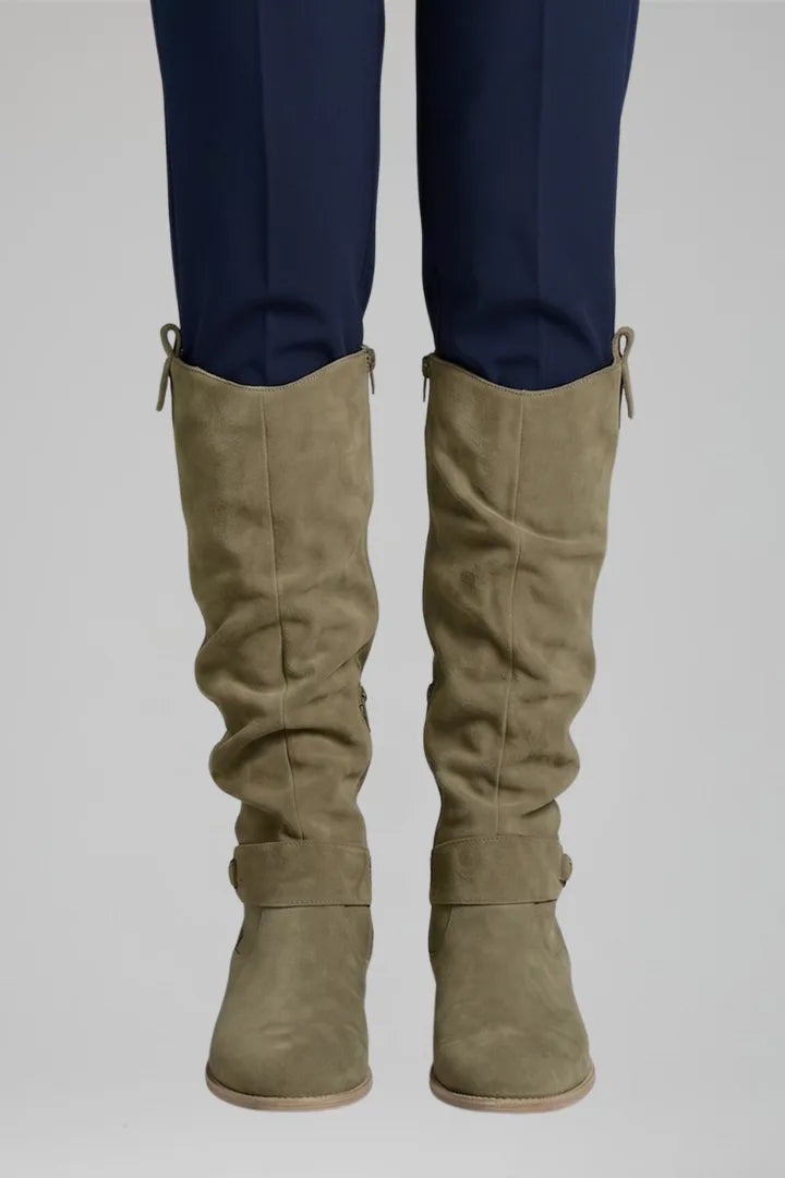 Close-up front view of the boots in a muted brown suede shade with slouch detailing at the shaft