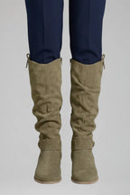Close-up front view of the boots in a muted brown suede shade with slouch detailing at the shaft