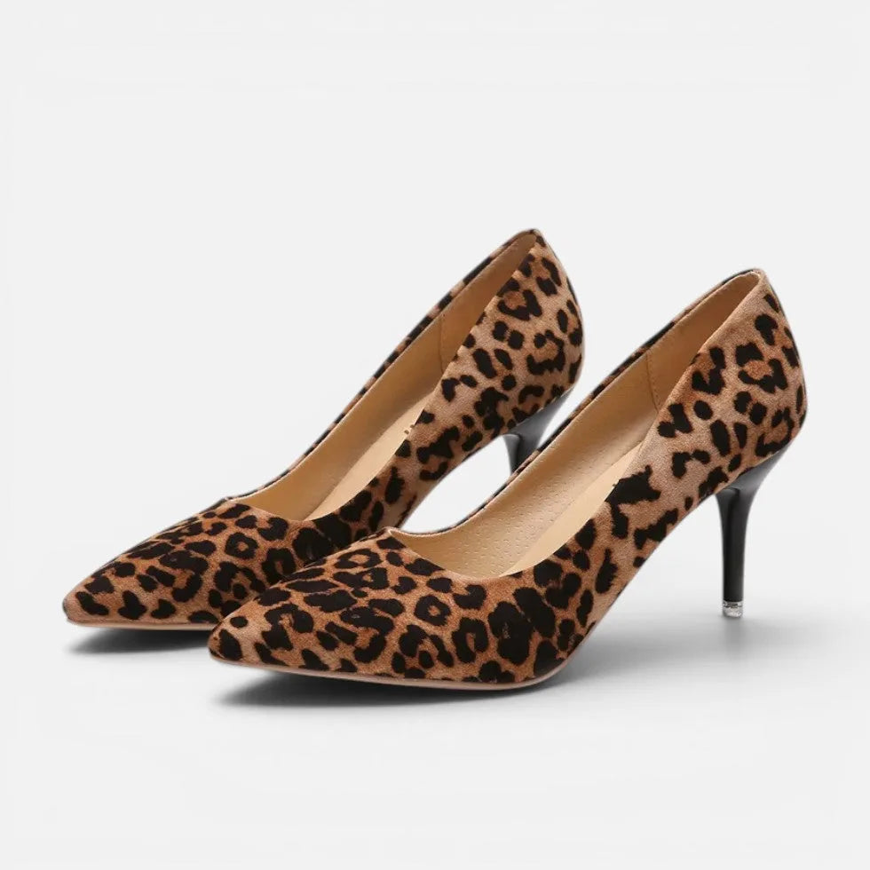 Angled pair view of leopard print suede pointed toe heels showing matching pair and slender heel design