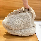 Side close-up of a cream loafer showing the ridged comfort outsole and chunky textured tread