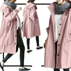 Front view of a light grey hooded trench coat with visible black button fastenings and roomy pockets