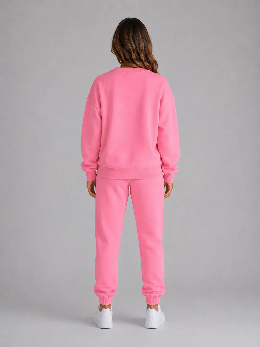 Back view of the pink oversized tracksuit set showing the ribbed collar and relaxed drop-shoulder fit