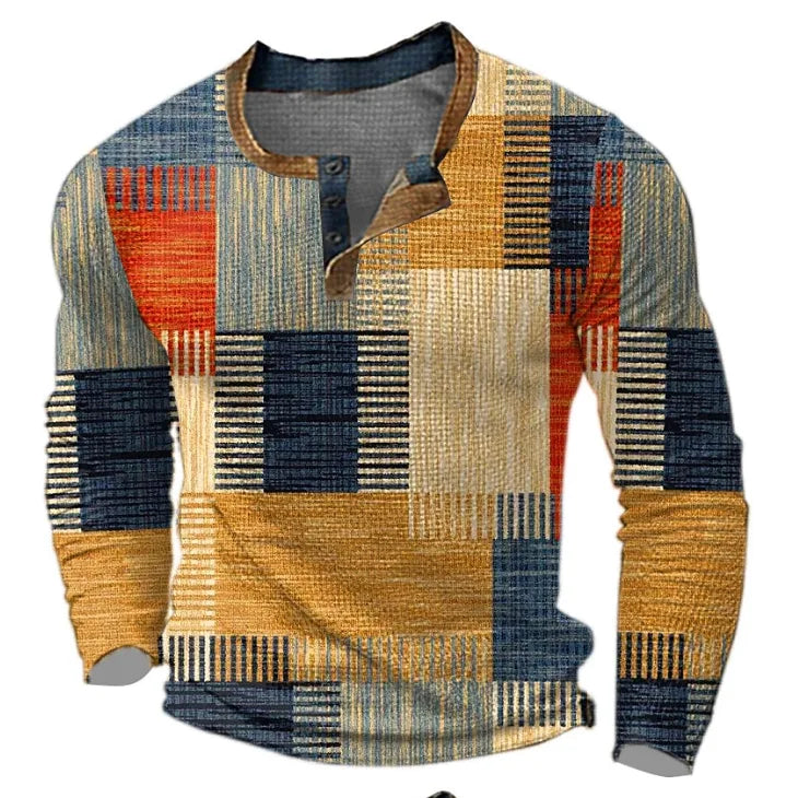 Orange, blue and red patchwork-print Henley jumper with buttoned placket and brown trim collar, front view on hanger