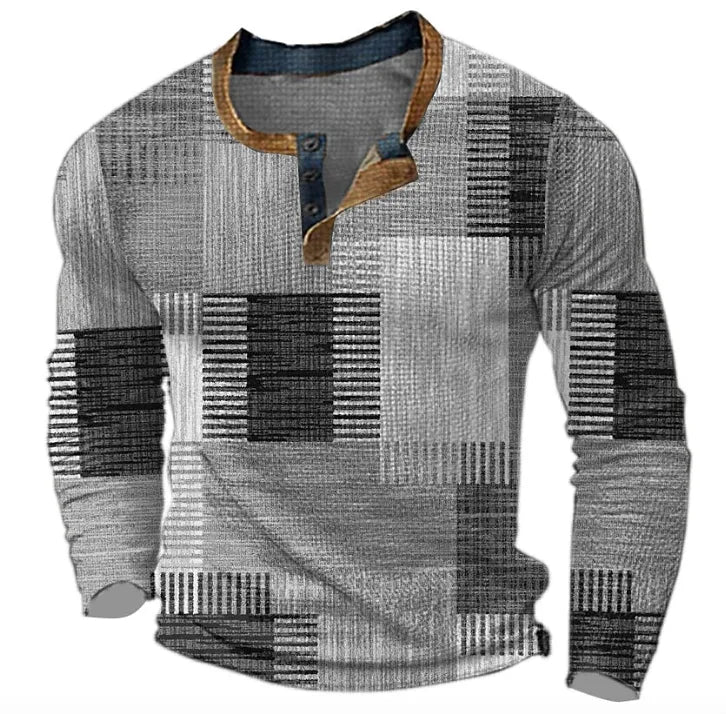 Grey and black patchwork-print long-sleeve Henley top with tan trim collar, front view on hanger