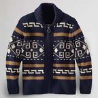 Flat lay of navy blue zip-up cardigan showing full shawl collar, zip fastening and geometric patterned knit across the front