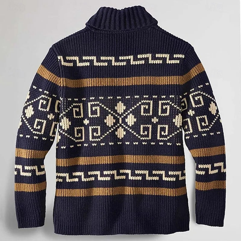 Back view of the navy blue patterned cardigan showing the ribbed shawl collar and knitted geometric design across the shoulders