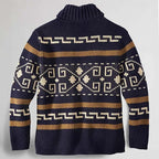 Back view of the navy blue patterned cardigan showing the ribbed shawl collar and knitted geometric design across the shoulders