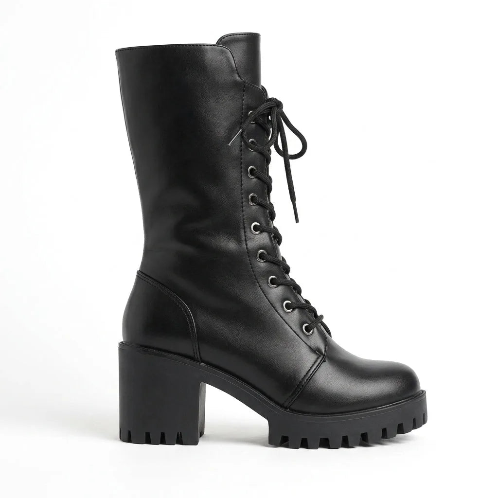 Side profile of black lace-up combat boot with chunky lug platform sole and block heel against a white background