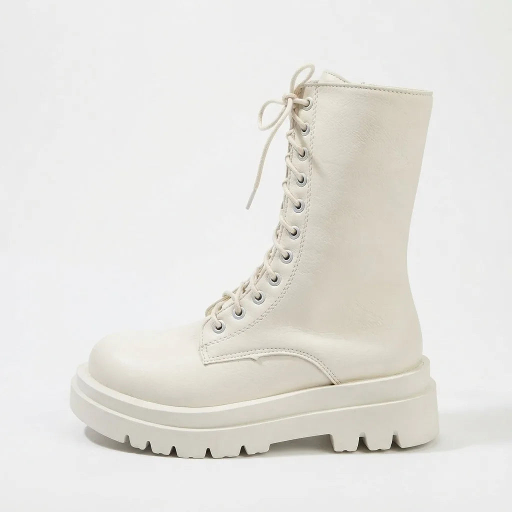 Side profile of off-white leather lace-up combat boot with matching chunky platform sole