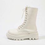 Side profile of off-white leather lace-up combat boot with matching chunky platform sole