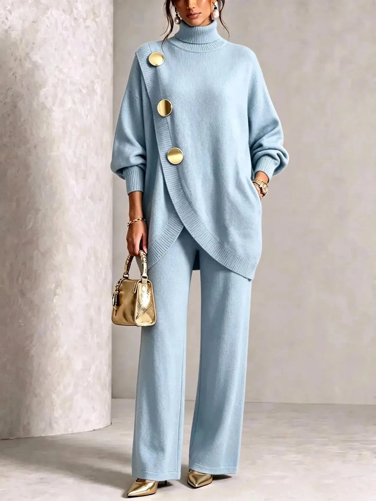 Pale blue two-piece knit set showing the flowing wide-leg trousers and side pocket detail