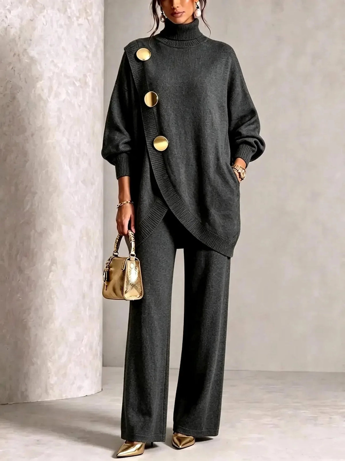Charcoal grey knit set worn with pointed gold mule heels, highlighting the wide-leg trouser silhouette